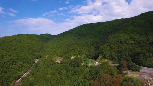 Winding Road Trough the Forest. Hi Mountain Pass in Transylvania, Romania.