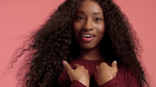 Woman Smiling with Long Curly Hair