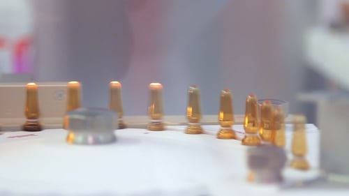 Sterile Ampoules Sealed with Fire. Ampoules on Production Line of Pharmacy Plant