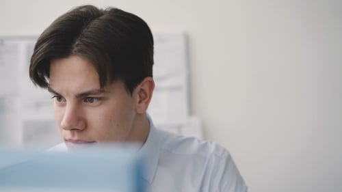 Man Works with Computer in Office