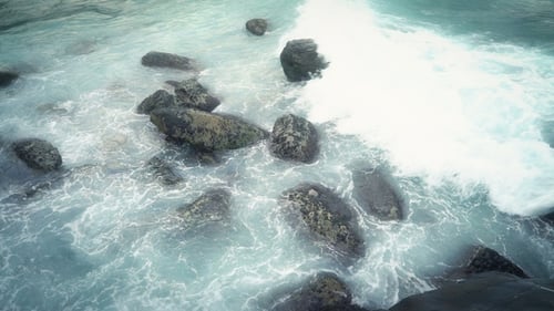 Waves Crashing on Rocky Beach Shoreline