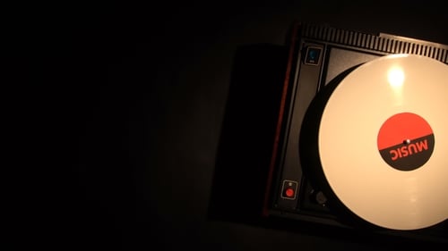 Record Player Spinning White Vinyl in Dark Room