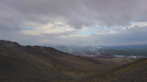 Cogeneration Power Plant in City. View From Mountains. Combined Heat and Power Plant Near Town