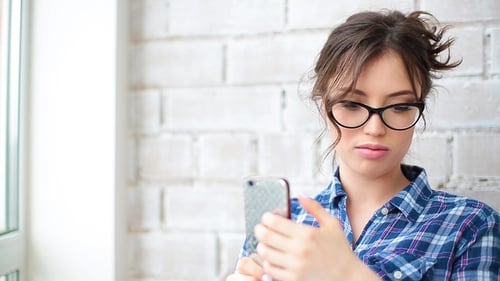 The Girl Had a Bad Conversation on the Phone and Is Nervous.