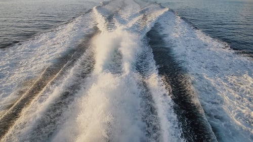 Background of Water Trail Foaming Behind a Ferry Boat