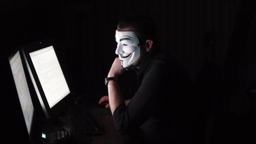 The Hacker in the Mask Hacks the Program. the Digital Extortion Gets Access To Other People's