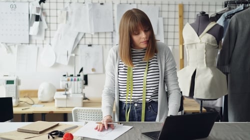 Woman Designs Clothing in her Creative Studio