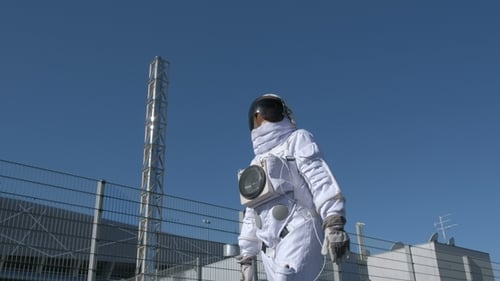 Astronaut Goes To the Expedition,. In the Background Is His Base. The Concept of Futuristic
