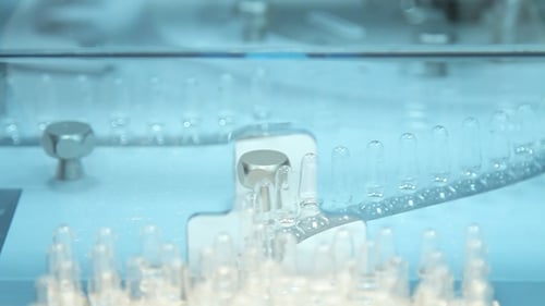 Medical Ampoules on Pharmaceutical Manufacturing Line at Pharmacy Factory