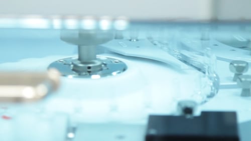 Automated Machine Adding Fluid to Tubes