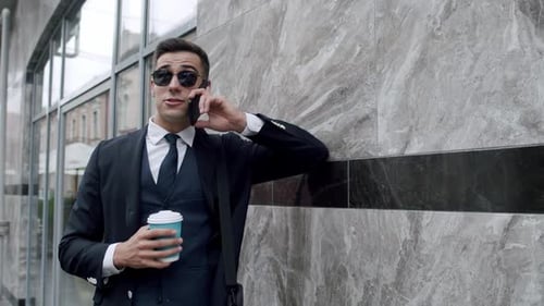 Professional Man Talking on Phone in City