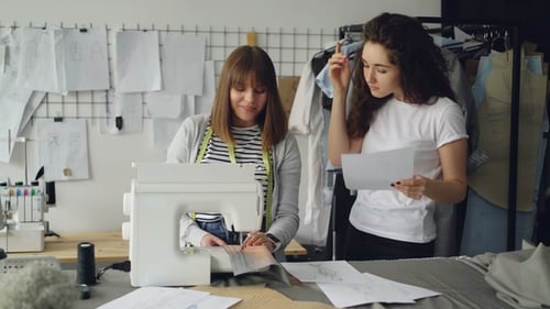 Fashion Designers Collaborating in Bright Creative Studio