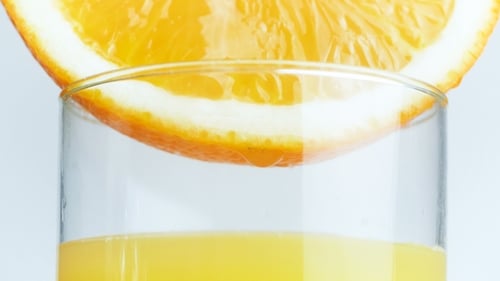 Fresh Orange Juice with Juicy Orange Slice Garnish