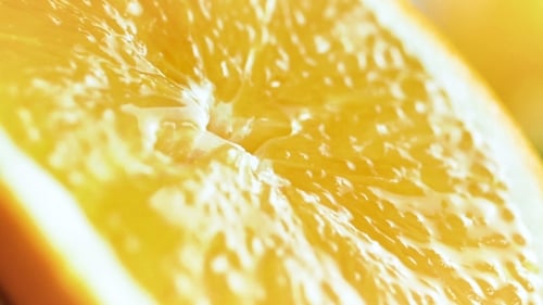 Footage of Juicy Orange Being Squeezed
