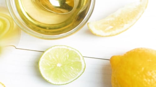 View From Top on Oranges, Lemons, Grapefruits, Limes, Honey and Glass of Juice on White Wooden Table