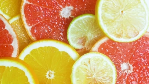 Video of Camera Moving Over Assortment of Citrus Fruits Lying on Table