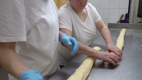 Traditional Italian Bakery. Two Female Bakers Prepare Sweet Buns with Cream Pasticcera