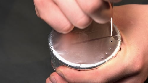 Foil Poked with Holes for a Tobacco Device