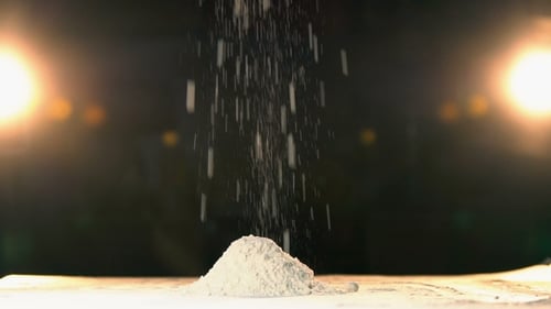 Hand Throwing Flour in a Heap Rapid. Hand Throws White Powder Mountain