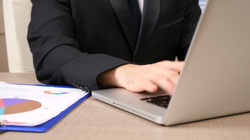 Man Typing on Laptop in Office, Close Up