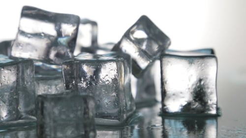 Icy Ice Cubes on Reflective Surface