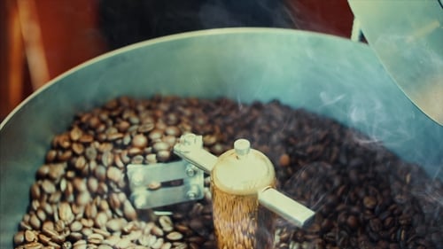Roasted Coffee Beans Being Mixed in Roasting Machine