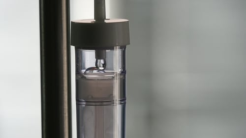 Liquid Dripping Slowly Through IV Fluid Drip Set