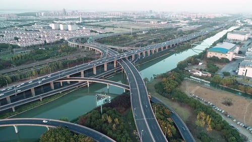Aerial View of Road Junction with Moving Cars. Road Interchange or Highway Intersection with Busy