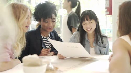 Women reading menu in restaurant