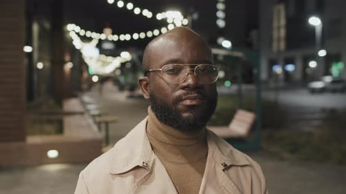 Man with Glasses Posing at Night Outdoors