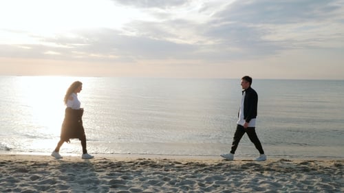 Young Trendy Man and Woman, People on Sand Beach, Happy Married Adult Couple Having Fun, Playing