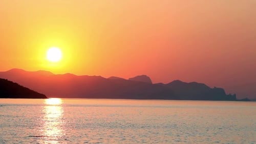 Beautiful Sunset at the Beach, Amazing Colors, Light Beam Shining Through the Cloudscape