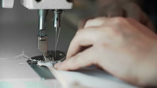 Sewing Machine Needle Stitching White Fabric Close Up