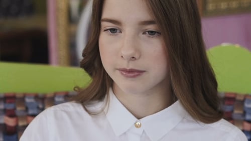 Young Woman Eating with Spoon, Close-Up