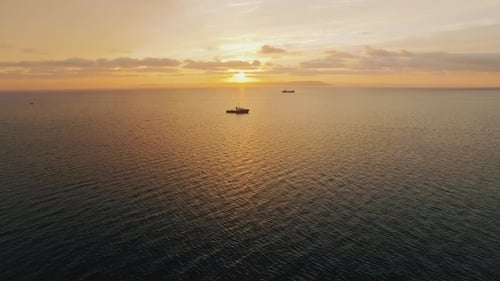 Ship Shoot By Drones in the Sea at Sunset
