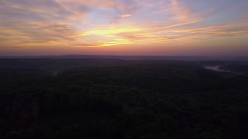 View of a Scenic Sunset Over the Forest Hills, with Toned Dramatic Colors