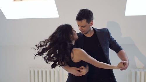 Young Couple Dancing the Salsa at the Dance Hall.