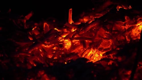 Glowing Red Embers Background in the Dark