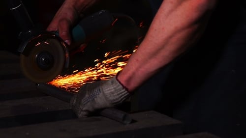 Man Grinding Metal with Sparks Flying