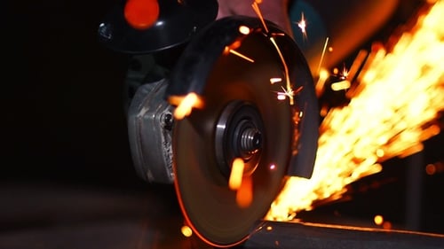 Cutting Metal With Power Tool Emitting Bright Sparks