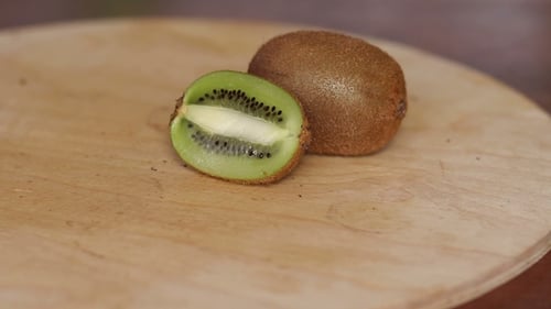 Sliced Kiwi Fruit on a Wooden Board
