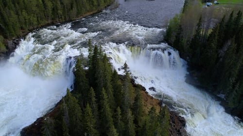 Aerial View of Powerful Waterfall in Green Forest