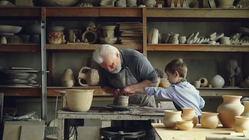 Adult and Child Making Pottery Together
