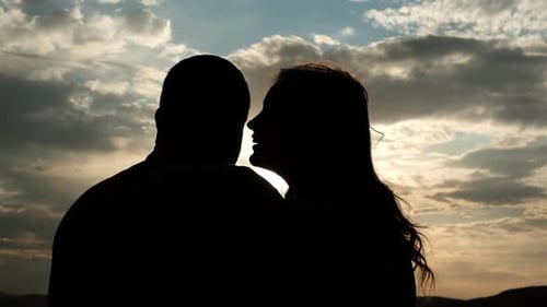 Romantic Couple Embracing at Sunset Silhouette