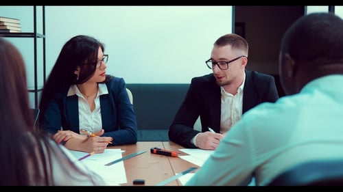 Diverse Team Collaboration Meeting in Workplace