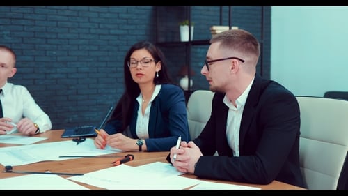 Adults Meeting and Discussing Business in Office