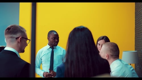 Diverse Team Meeting in Modern Corporate Office