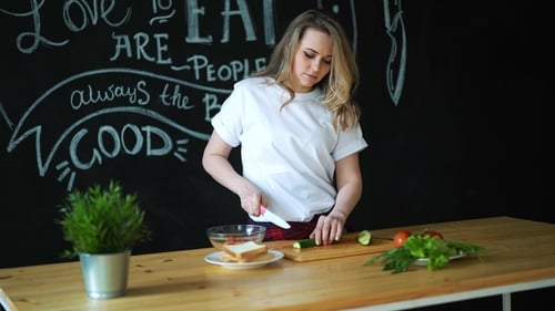 Woman Prepares Healthy Food in Kitchen