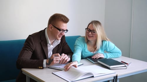 Positive Male and Female Students Doing Homework Together Spending Time in Campus,colleagues Making