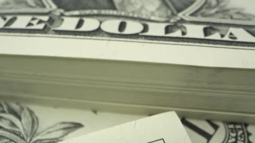 Moving over 1 dollar USD bill up close